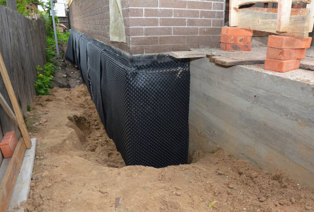 Happy homeowners after waterproofing job in Vermilion